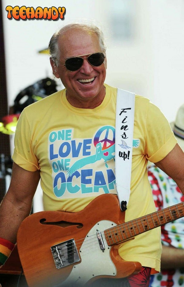 Musician Jimmy Buffett Wearing One Love One Ocean T-Shirt